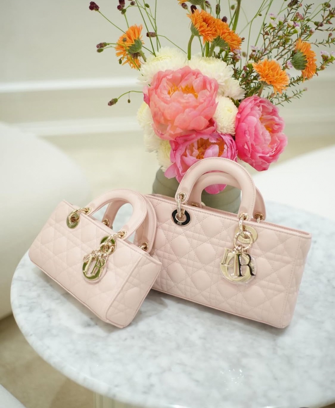 Premium geometric quilted lambskin leather handbag with metallic charms